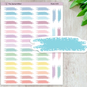 May include: A sheet of pastel colored washi tape stickers with a variety of colors and textures. The stickers are in the shape of a rectangle and have a rough, textured edge. The sheet is labeled "FUN-177" and "The Journal Effect".