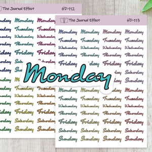 May include: A sheet of colorful stickers with the days of the week written in a cursive font. The stickers are arranged in rows and columns, with each day of the week repeated multiple times. The stickers are on a white background. The text "The Journal Effect" and "HD-112" and "HD-113" are printed at the top of the sheet.
