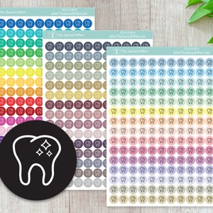 May include: Four sheets of colorful stickers with a tooth icon. Each sheet has 10 rows of 10 stickers, with each sticker featuring a different color and a white outline of a tooth with a sparkle on top. The sheets are labeled "The Journal Effect" and include a website address.