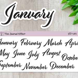 May include: A sheet of 12 black and white cursive month stickers. The months are January, February, March, April, May, June, July, August, September, October, November, and December. The stickers are on a white background with a light purple border. The text "The Journal Effect" and "HD-141" are printed in the top corners.