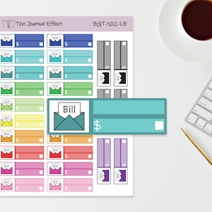 May include: A printable sheet of colorful bill tracker stickers with a blue envelope icon and the text "Bill" in white. The sheet is labeled "The Journal Effect" and "BGT-102-LB".