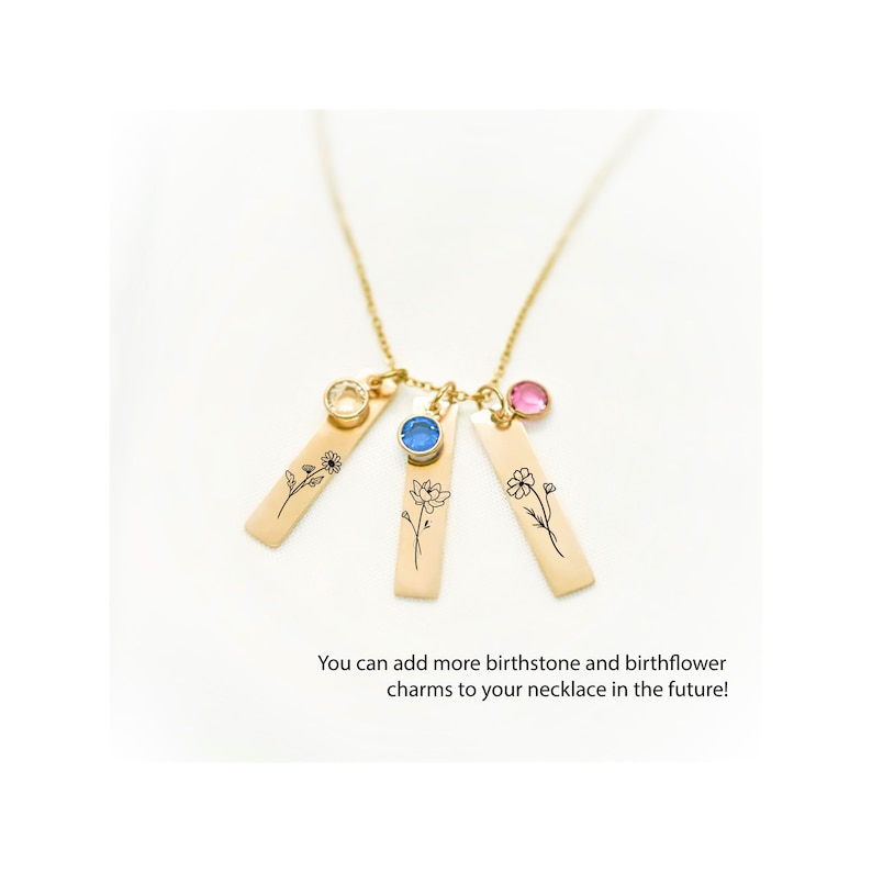 Gold birth flower necklace with personalized birthstone charms. Features engraved floral designs representing birth months. Additional charms can be added over time. A sentimental and elegant gift for mothers, grandmothers, or loved ones on special occasions.