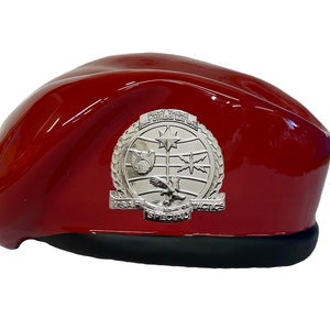 May include: A red beret with a silver emblem that reads "First There, Always There, USAF Special Tactics".