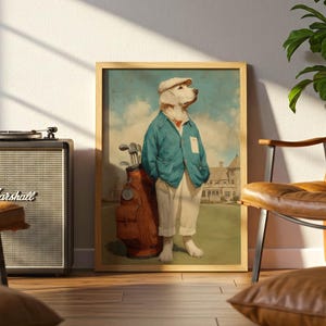 May include: A framed print depicts a golden retriever dressed in golf attire, including a blue jacket, white pants, and a cap. The dog stands next to a golf bag on a green course, with a building in the background. The artwork is in a wooden frame.