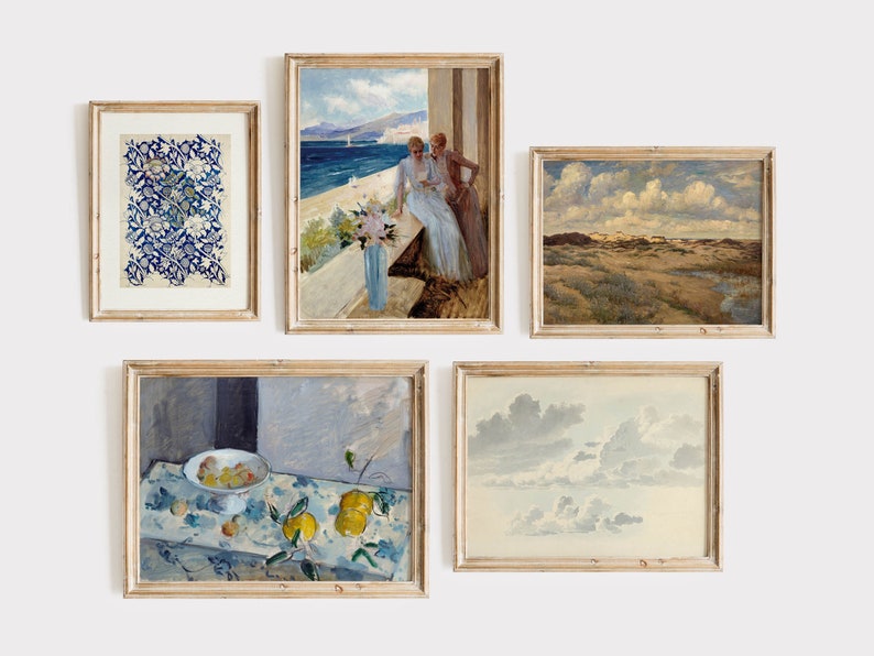 May include: Five framed paintings on a white wall. The paintings are in various styles and depict different scenes, including a floral pattern, a seascape with two women, a landscape with a cloudy sky, a still life with lemons and a bowl of fruit, and a sky with clouds.
