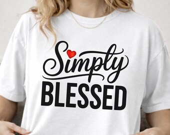 May include: A white short-sleeved t-shirt featuring the black text Simply BLESSED with a small red heart icon above the word Simply. The shirt has a crew neckline and a relaxed fit, with the word white printed in the bottom right corner.