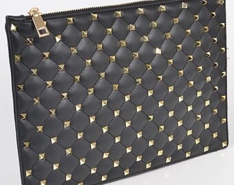 gold studded clutch bag