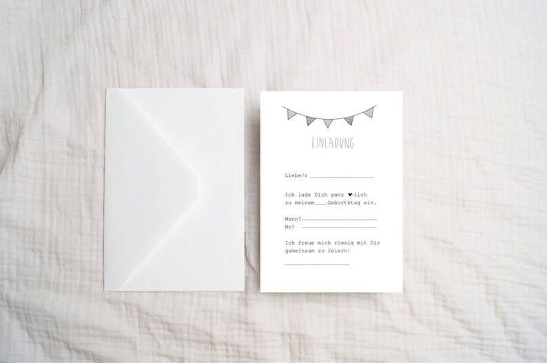 May include: A white card with black text and a simple illustration of a string of flags. The text reads "EINLADUNG" and includes the phrase "Ich lade Dich ganz herzlich zu meinem Geburtstag ein."