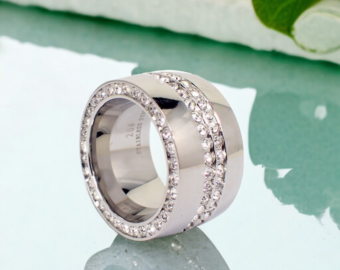 Stainless steel ring for women in silver with 3 rows of cubic zirconia, IP coating, stylish 15 mm wide ring with white stones, solid statement piece