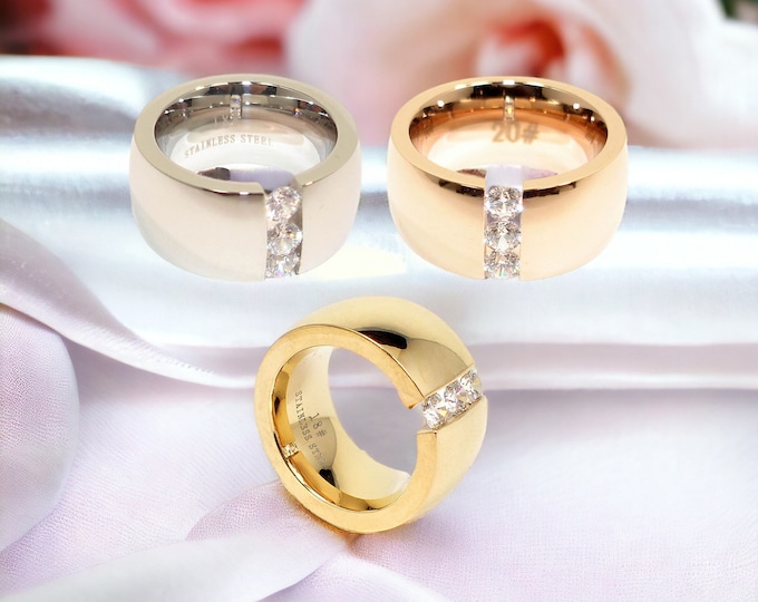 Fashionable women's stainless steel ring, 12 mm, in silver and rose gold with IP coating - Stylish wide ring with three white stones, statement piece