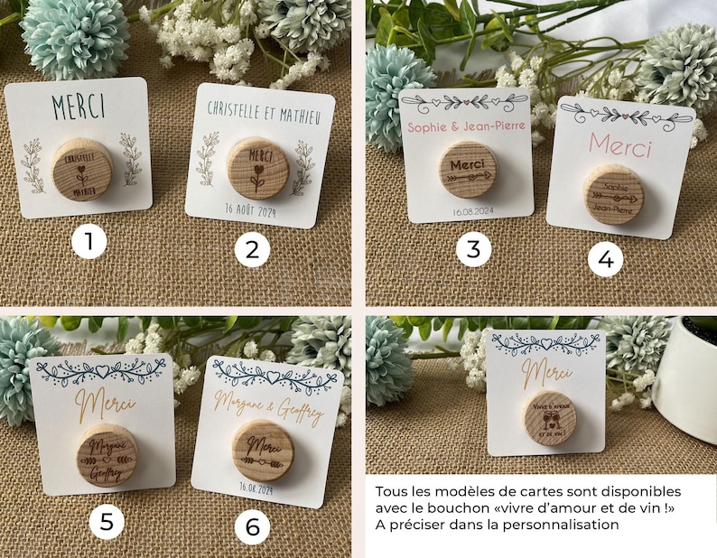 May include: A collection of six small, white cards with wooden bottle stoppers. Each card features the word "MERCI" or names, dates, and decorative elements. The stoppers have engraved designs, including hearts and arrows.