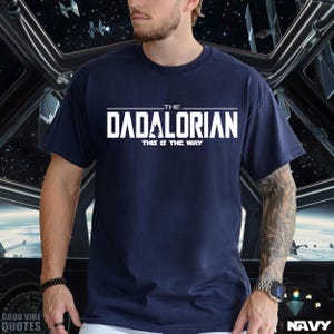 May include: A navy blue t-shirt with white text that reads "The Dadalorian This is the Way".