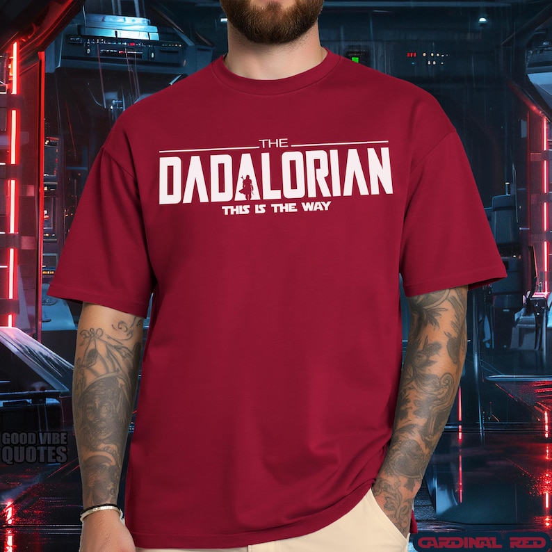 May include: A red t-shirt with white text that reads "The Dadalorian This is the Way".