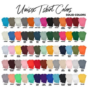 Puede incluir: Una carta de colores que muestra una variedad de colores lisos para camisetas unisex. La carta incluye colores como aguamarina, negro y rosa, con el texto "Unisex T-shirt Colors" en la parte superior.