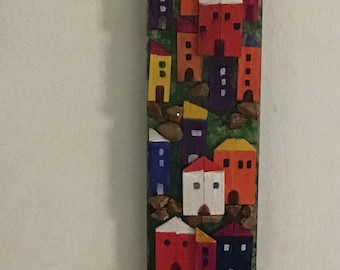 Hand-painted wooden stele and pebbles. Seascape.Bright colors