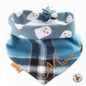 a blue bandana with ghost faces on it