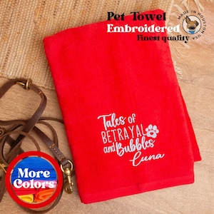 May include: Red pet towel with white embroidery that reads "Tales of Betrayal and Bubbles Luna". The towel is made in the USA and is of the finest quality.