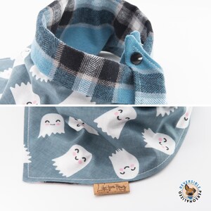 a dog bandana with ghost faces on it
