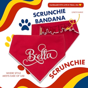 May include: Red dog bandana with white embroidered text "Bella" and a white scrunchie attached. The bandana is labeled "Scrunchie Bandana" and "Stretchable".