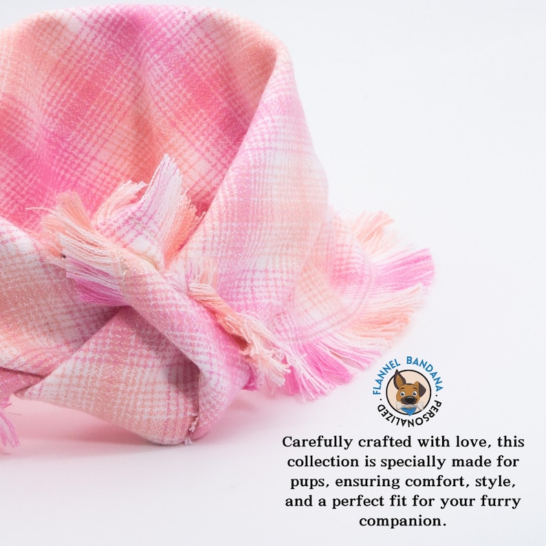 a pink and white checkered scarf with a quote on it