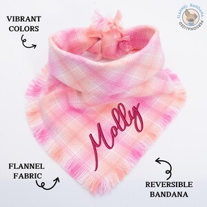 a pink and white scarf with the words yolly written on it