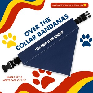 May include: A navy blue bandana with white trim and the text "OVER THE COLLAR BANDANAS *The collar is not included*" printed on it. The bandana is folded in a triangular shape and is shown on a white background with paw prints and colorful wavy lines.