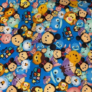 May include: A blue fabric with a repeating pattern of colorful cartoon characters. The characters are all different Disney characters, including Mickey Mouse, Minnie Mouse, Donald Duck, Goofy, and Pluto. The fabric is perfect for crafting projects, such as making bags, pillows, and quilts.