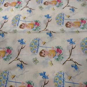 May include: A repeating pattern on a cream-colored fabric featuring illustrations of babies, blue birds, butterflies, and parasols. The babies are wearing yellow outfits and holding pink hearts. The parasols are blue and yellow.