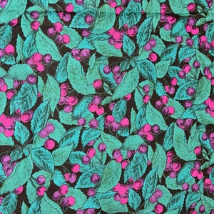 May include: A seamless fabric pattern featuring a repeating design of pink and purple cherries on teal green leaves against a black background.