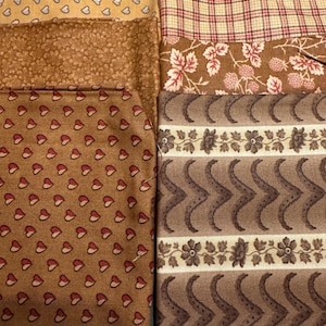 May include: Assortment of fabric swatches in various brown tones with different patterns, including hearts, leaves, plaid, and wavy lines.