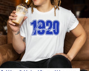 May include: A white t-shirt with a blue graphic that says "1920" with a handwritten "Forever" underneath.