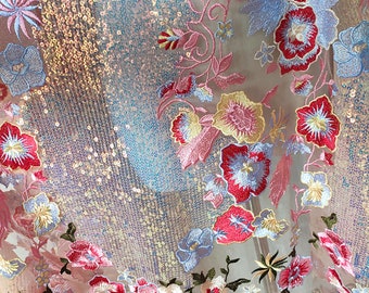 May include: Pink sheer fabric with iridescent sequins and embroidered floral designs in shades of pink, blue, yellow, and red.