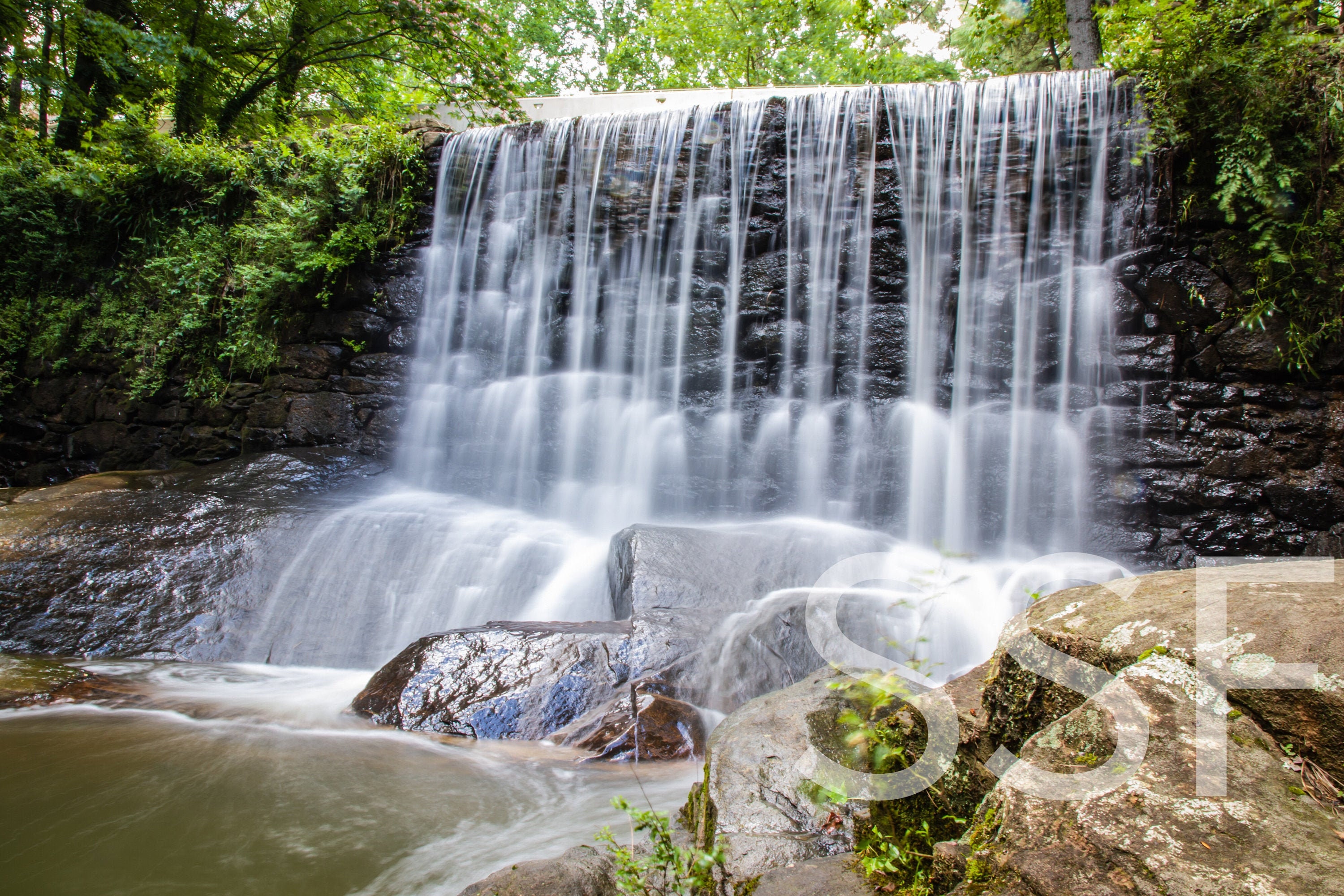 Breathtaking Perspective of Water Flowing Over Scenic Waterfall Into ...