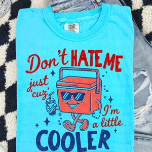 Don’t Hate Me, I’m Cooler
Comfort Colors 1717 Tee
Multiple Shirt Colors Available
Funny Summer Graphic Tee
Lake Day + Boat Day Ready
Perfect for Camping Trips
Cute Gift for Summer Girls