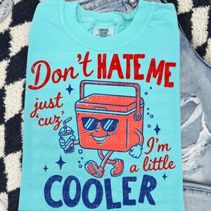 Don’t Hate Me, I’m Cooler
Comfort Colors 1717 Tee
Multiple Shirt Colors Available
Funny Summer Graphic Tee
Lake Day + Boat Day Ready
Perfect for Camping Trips
Cute Gift for Summer Girls