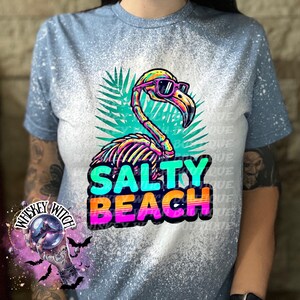 Salty Beach Shirt, Skeleton Flamingo Tee, Spooky Summer Graphic T-Shirt, Beach Goth Handmade Top Heather Indigo