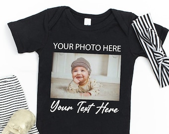 May include: Black and white striped leggings, gold shoes, a black bodysuit with a photo of a baby and the text "Your Photo Here" and "Your Text Here", and a black and white striped headband.