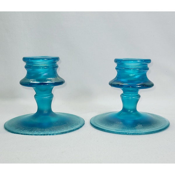 Fenton Celeste Blue iridescent stretch glass candleholders.