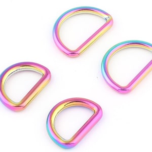 May include: Four iridescent rainbow-colored metal D-rings. The rings are approximately 1 inch in diameter.