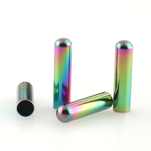May include: Four iridescent metal caps with a rounded top and a cylindrical body. The caps are a mix of green, blue, purple, and gold.