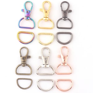 May include: Set of 10 metal swivel clasps and D-rings in various colors, including rainbow, gold, silver, black, and rose gold. The clasps are approximately 2.5 cm long and the D-rings are approximately 2 cm in diameter.