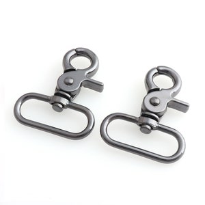May include: Two silver-toned metal swivel clasps with a rectangular loop and a spring-loaded gate.