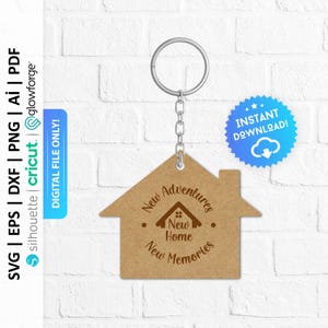 May include: A brown house-shaped keyring with the text "New Adventures", "New Home", and "New Memories".