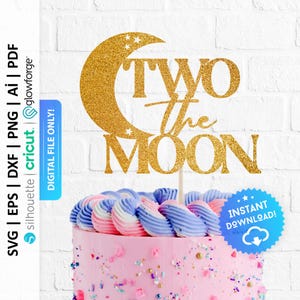 May include: Gold glitter cake topper with a crescent moon and stars, and the text "Two the Moon". The topper is on a pink and purple frosted cake with sprinkles.