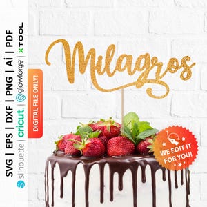 May include: Gold glitter cake topper with the name "Milagros" written in a cursive font. The topper is on top of a chocolate cake with strawberries and a white background.