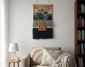 Wanddecoratie van wol met franjes – handgeweven boho-textiel