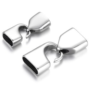 May include: Two silver-toned metal clasps with a hook and loop closure. The clasps are designed for use with necklaces, bracelets, or other jewelry.