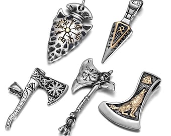 May include: Five silver pendants with intricate designs. The pendants feature a compass, an arrowhead, an axe with a wolf, an axe with a compass, and a simple axe. The pendants are all made of metal and have a silver finish.