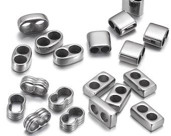May include: A collection of silver-toned metal jewelry making supplies. The supplies include oval and rectangular double-hole connectors, and small, round, double-loop connectors.