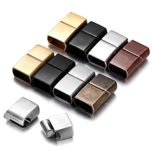 May include: A selection of rectangular magnetic clasps in gold, black, silver, and bronze finishes. These clasps are designed for jewellery making and feature a simple, secure closure mechanism.